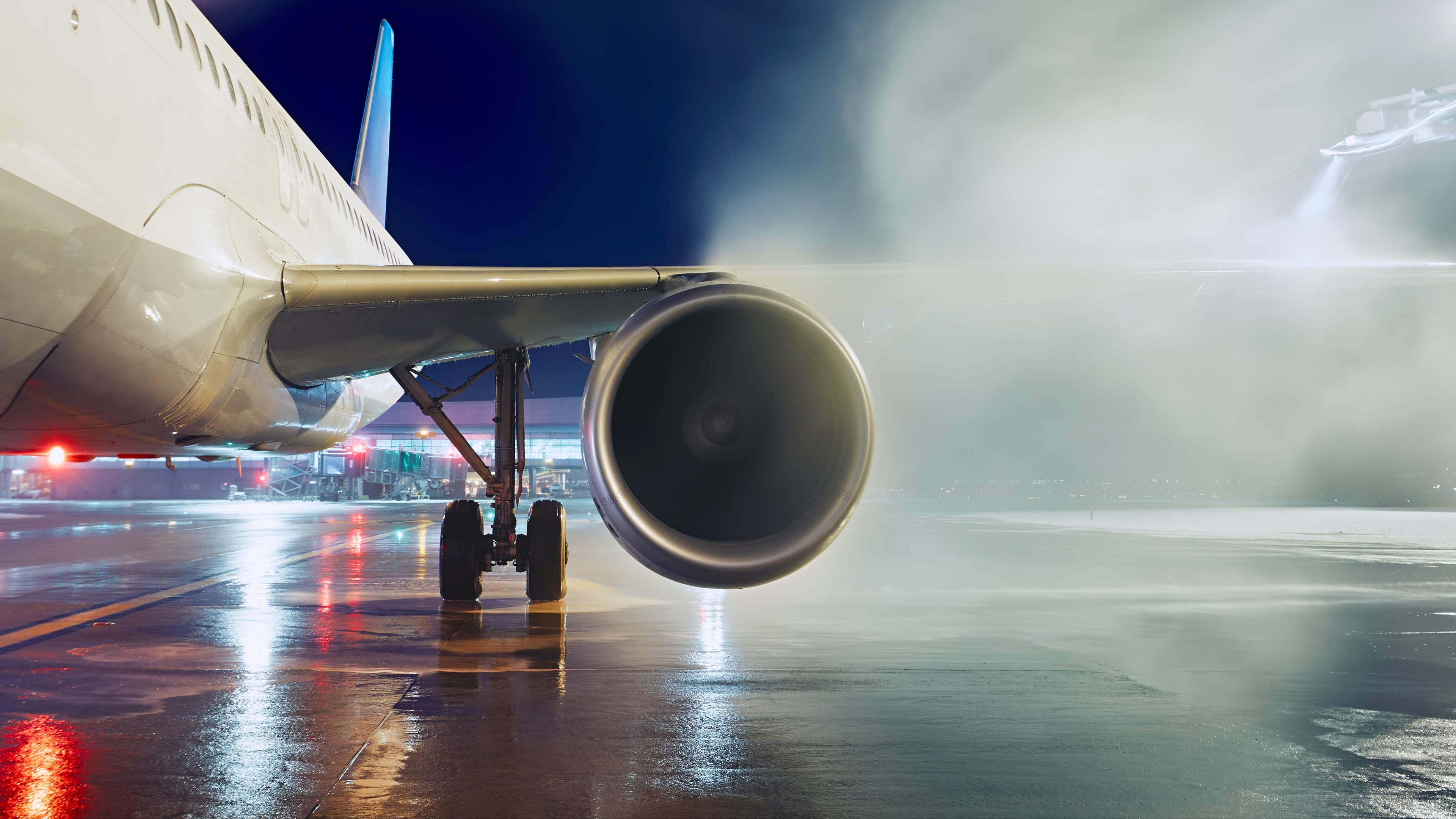 Private jet parked on the tarmac at dusk